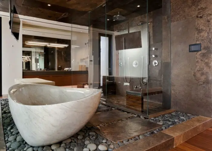 Gorgeous stone bathtub (designtrends.com)
