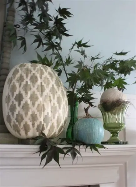 Work with stencils to paint designs on pumpkins for a fresh fall display (familyholiday.net)
