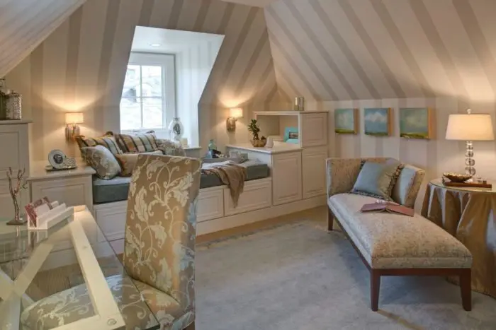A tucked away corner in the attic or a dormer room makes for a cozy spot to enjoy a rainy day (HGTV)