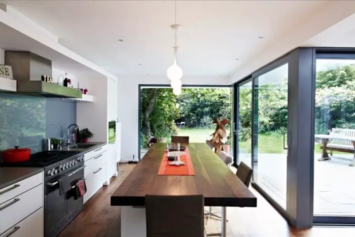 Let in the light to the kitchen with a window wall (home-designing.com)