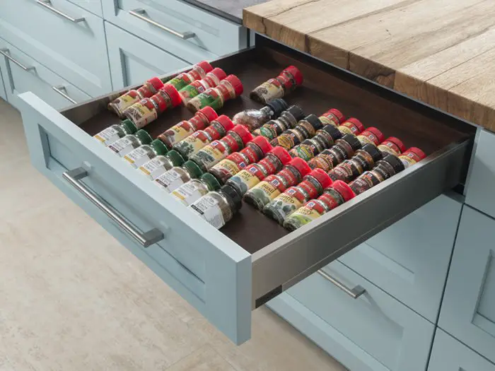 Spices are at hand in a custom drawer (wood-mode.com)