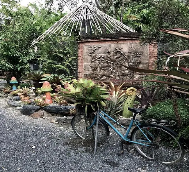 An old bicycle serving as a decoration in the garden