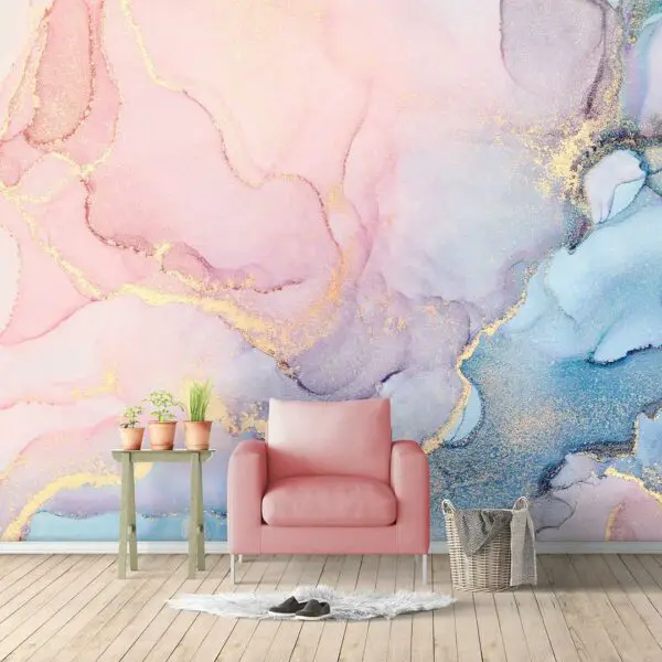 A vibrant living room showcases a pink chair and an eye-catching blue and pink marble wall mural, offering expressive individuality for teenagers seeking unique wallpaper ideas.